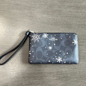 Coach signature snowflake, blue and silver corner zip wristlet, used like new❄️